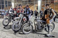 Following the twice interrupted Expert Open Feature at the penultimate Flat Track Canada National at Georgian Downs south of Barrie, ON, race winner (left) Tyler Seguin (No. 1 Honda), announcer Todd Vallee, third finisher American Justin Jones (No. 4 Husqvarna DTX) and runner-up Don Taylor (Sehl Rotax).  Note damaged foot peg on Taylor’s borrowed framer. [Photo: Colin Fraser]